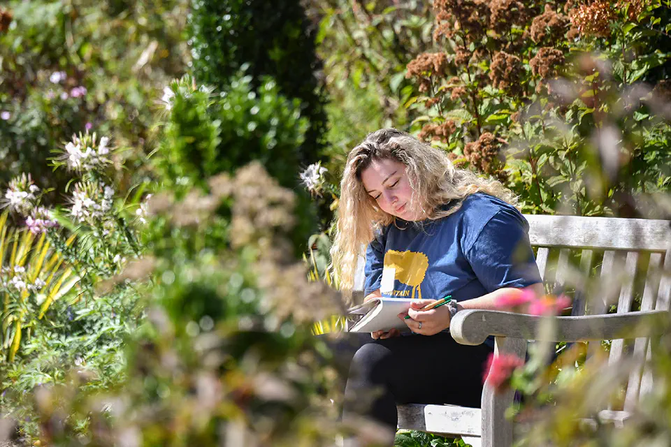 A student reading outside