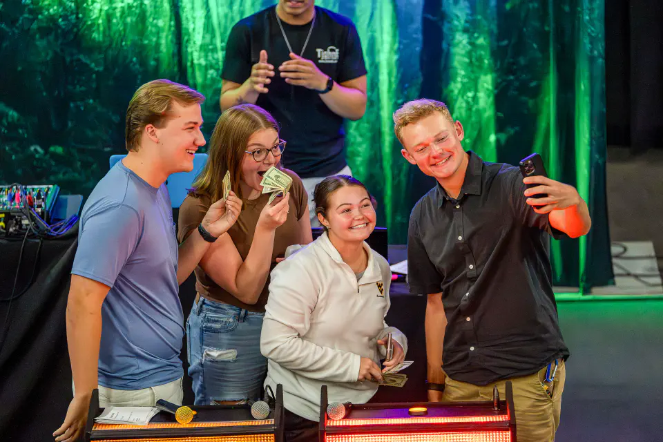Students pose for a photo after winning a cash prize at WVUp All Night.