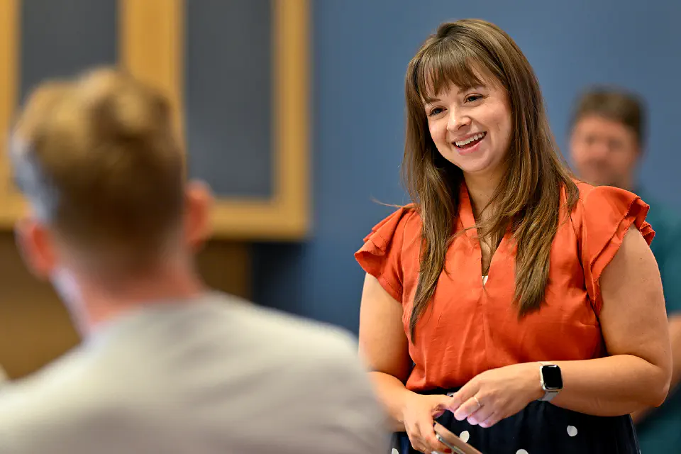 People sitting at a table having a pleasant conversation.