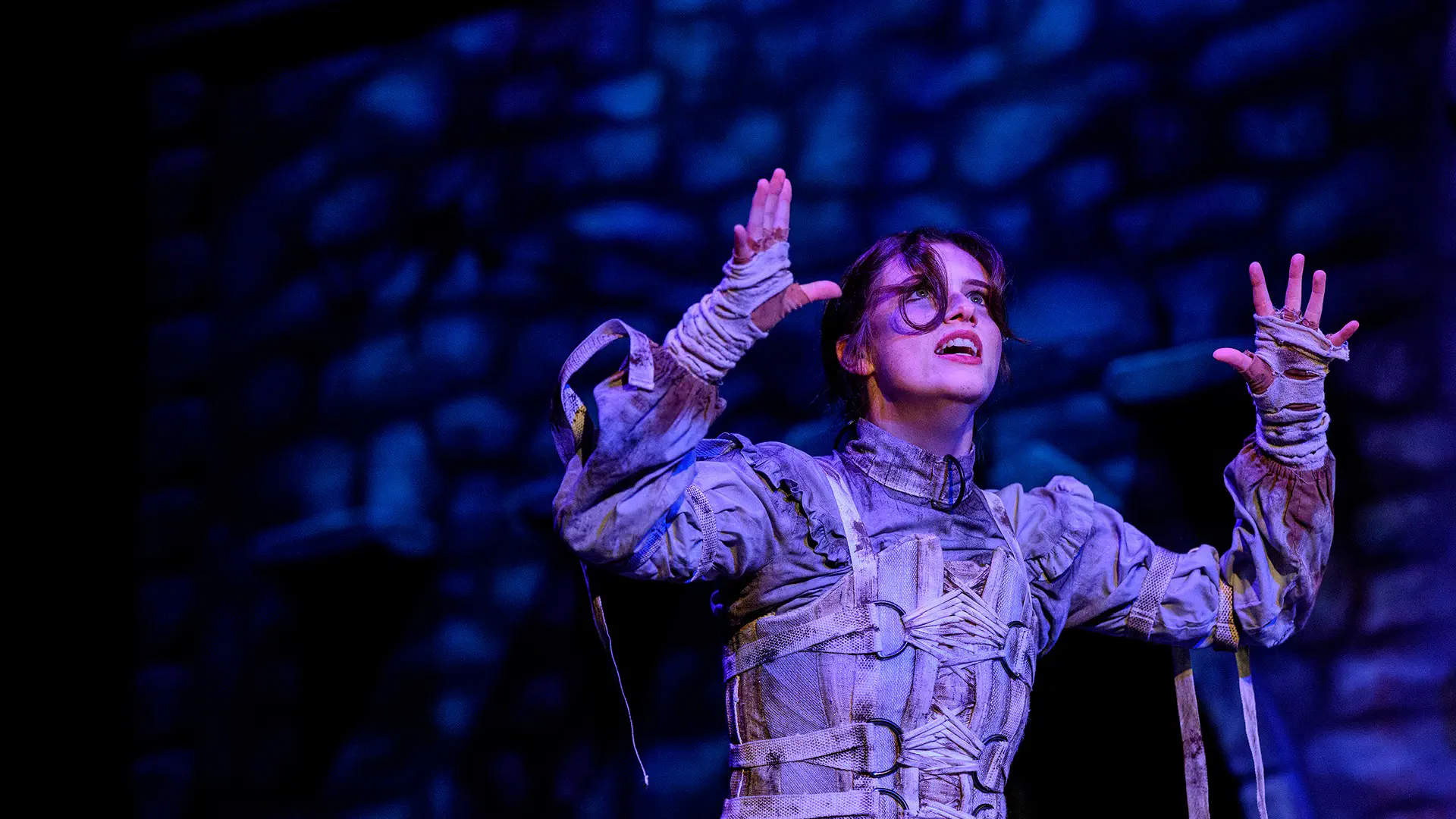 a theatre student performing on stage