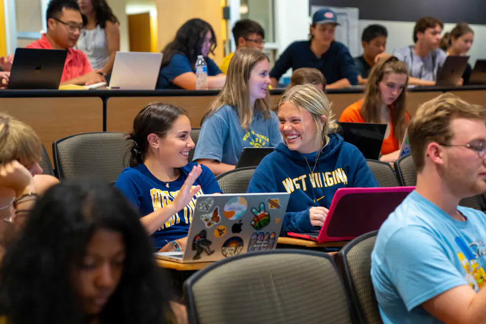Students sit excitedly in their first day of classes.