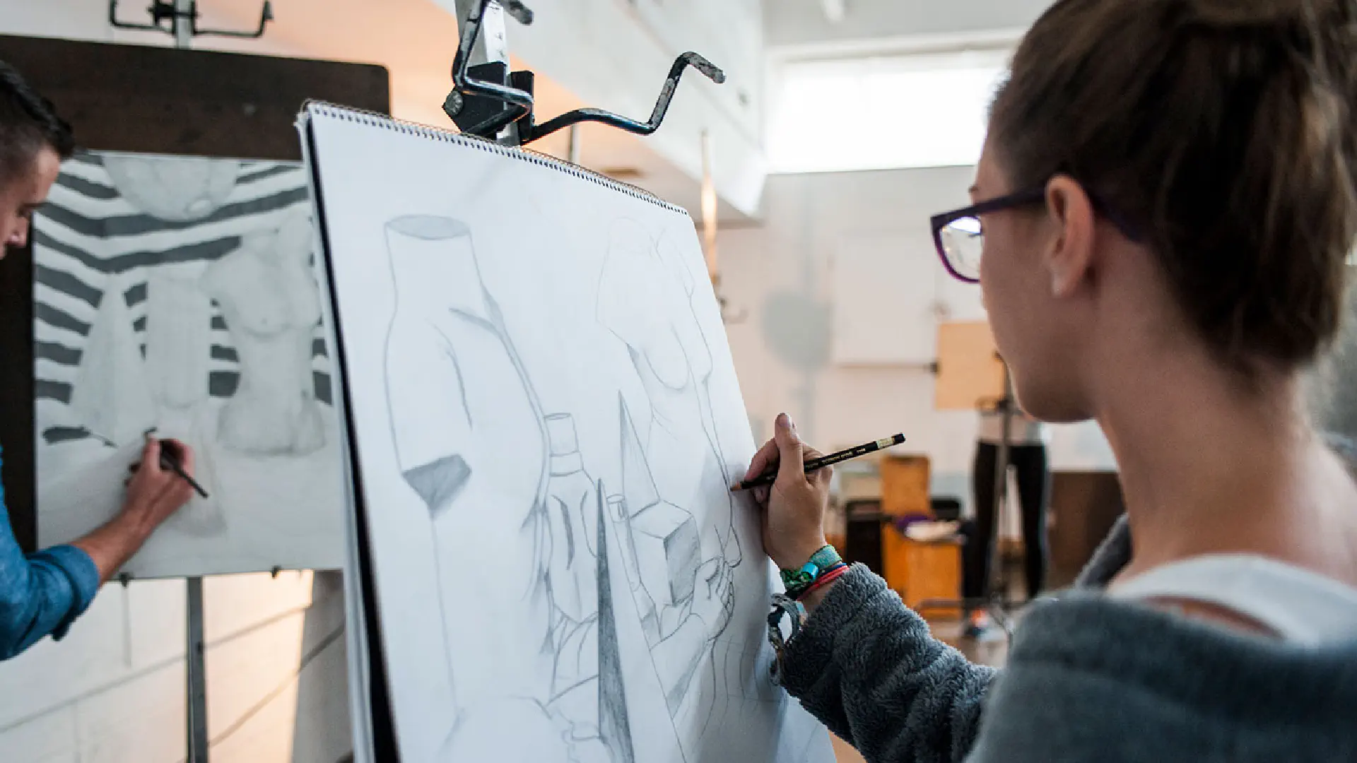 students drawing on easels