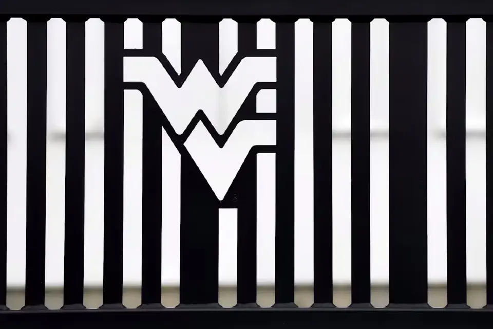 The flying WV insignia on a metal bench