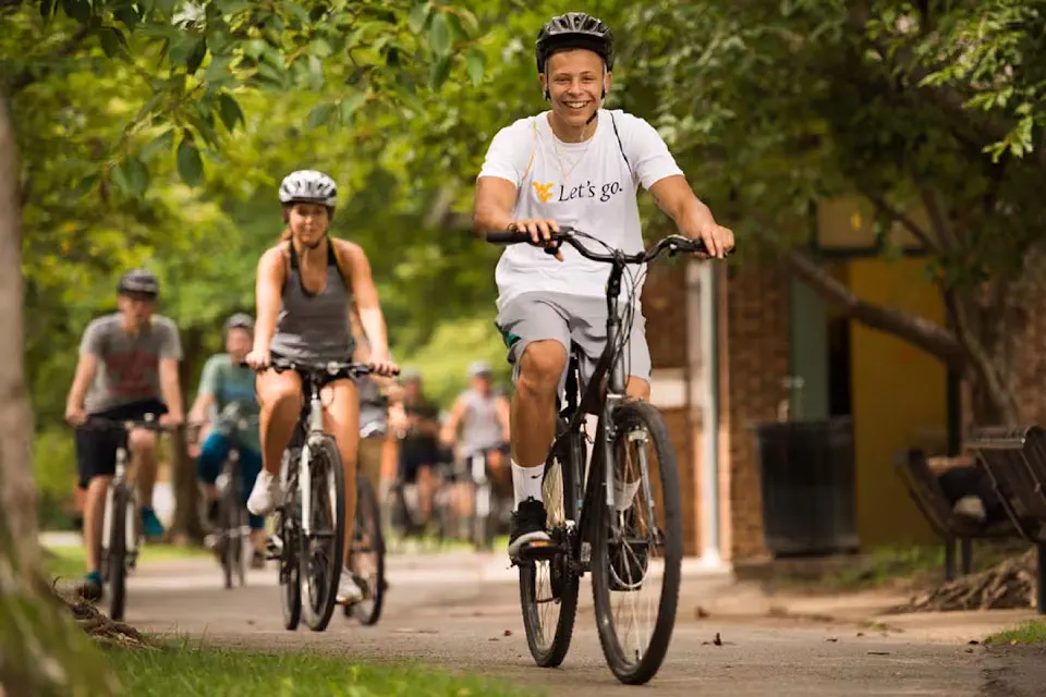 Students ride bikes on rail trail