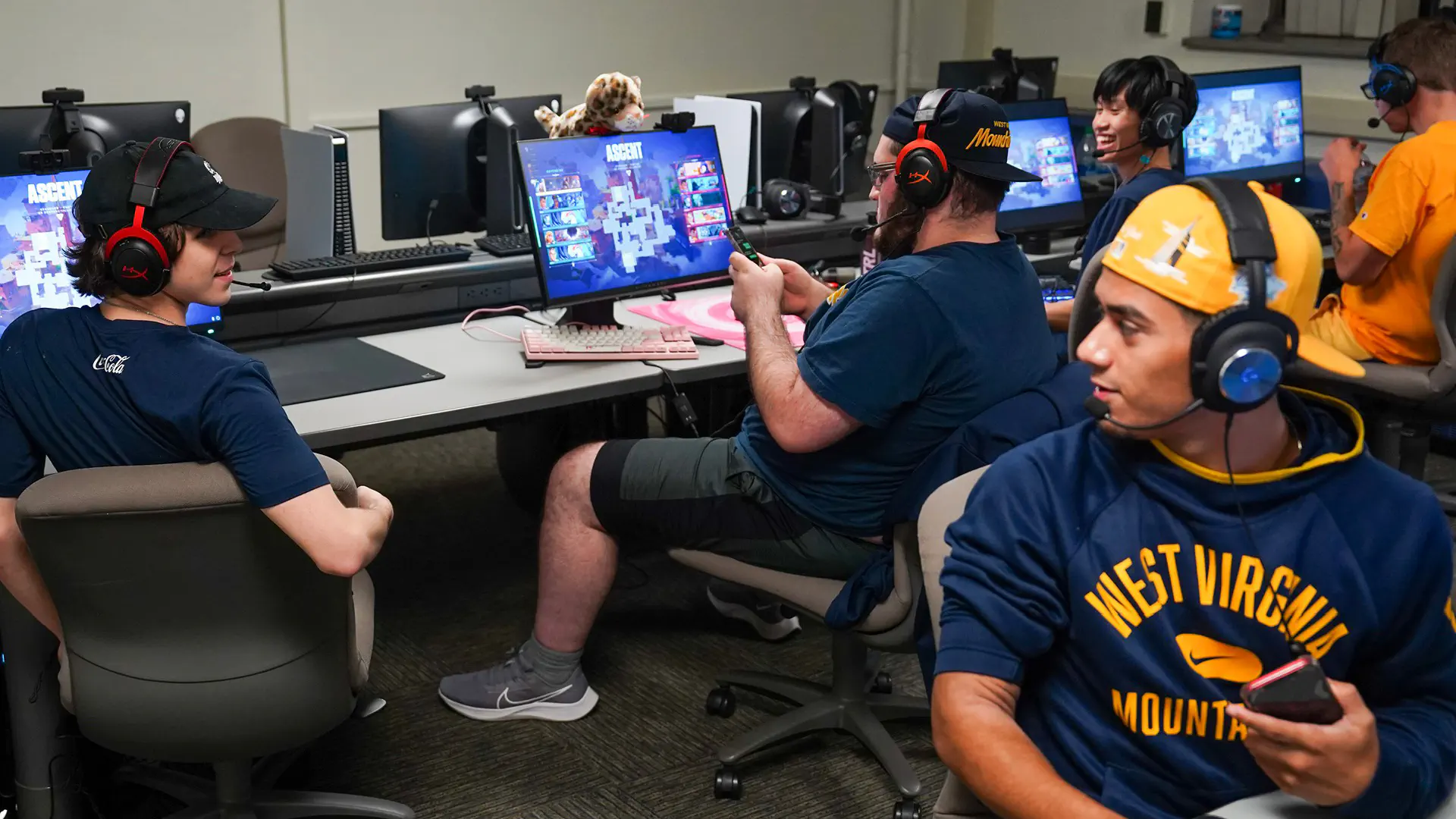 Valorant team members interact while competing at the Varsity Esports facility.