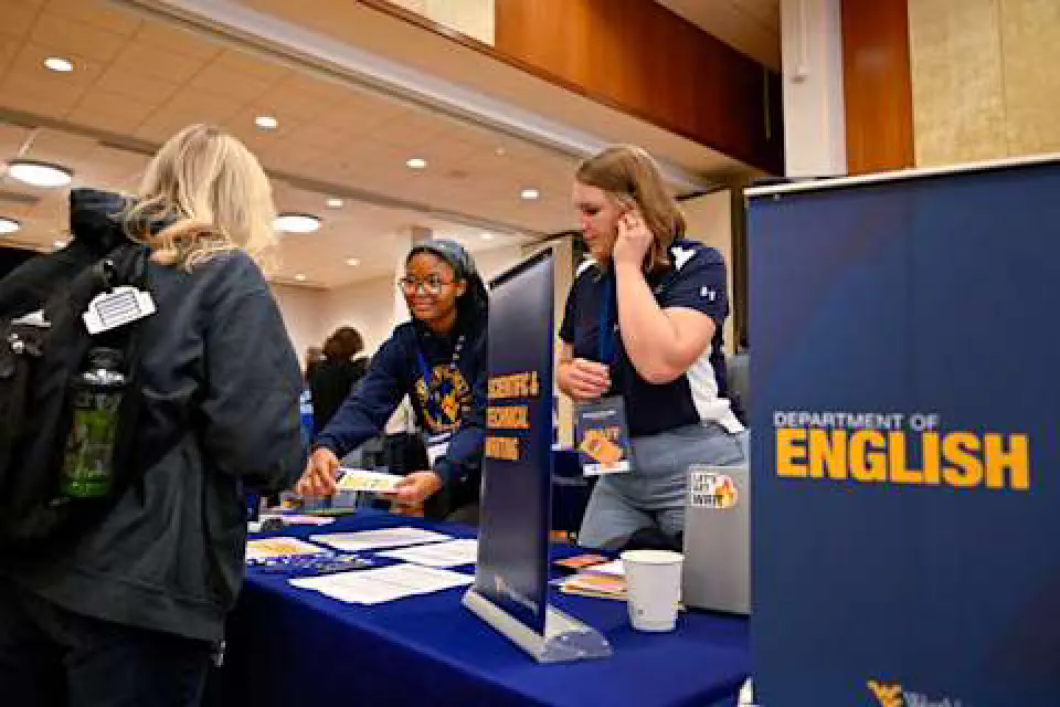 Students visit a booth for the Department of English