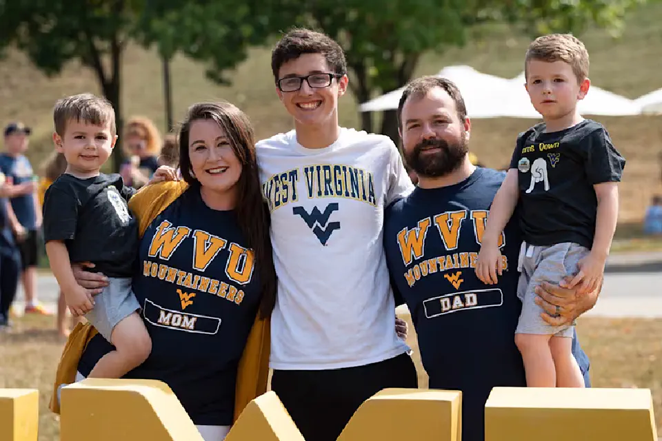 WVU student with parents and younger siblings