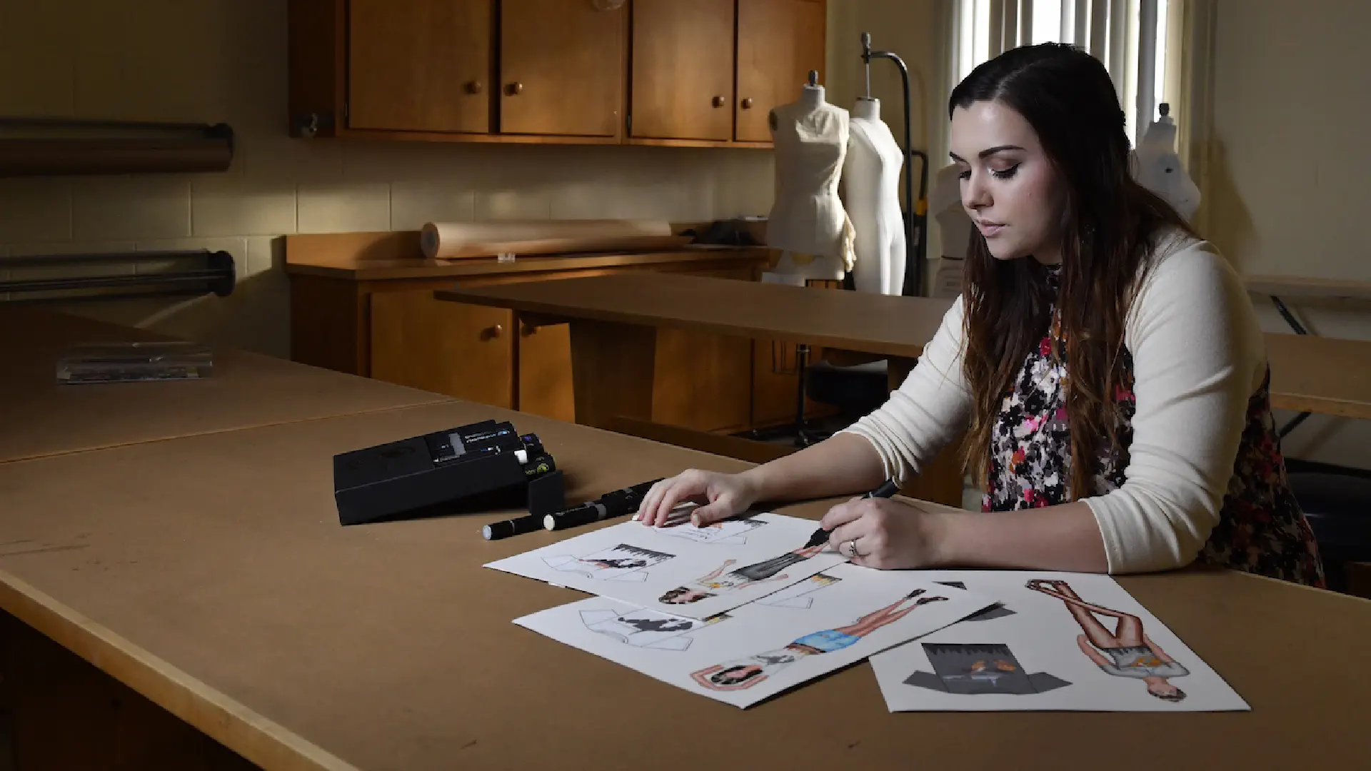 Person flipping through design pages