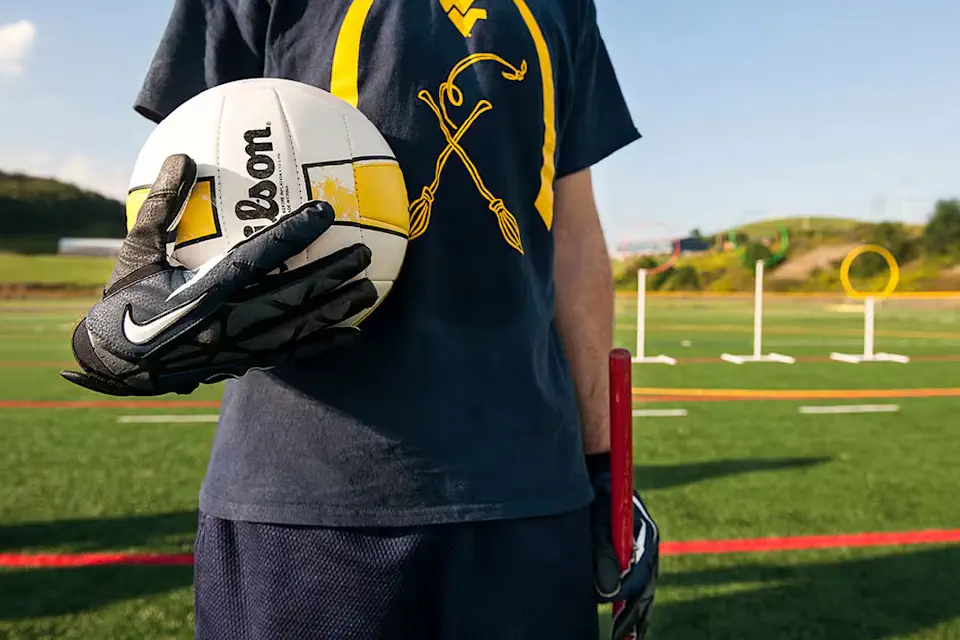 WVU Quidditch player in gold and blue team shirt